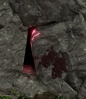 An in game image of a cave in the Farbane region with a cliff from which a player can descend.